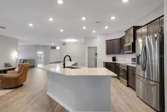 a kitchen with a sink and cabinets