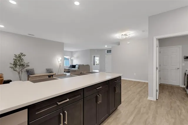 a kitchen with a sink and cabinets