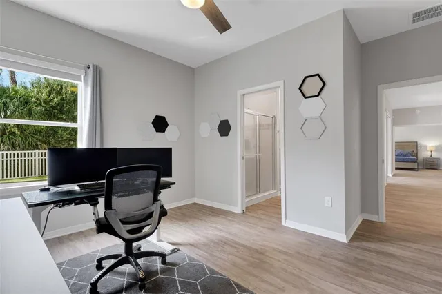 a en suite bathroom with a sink double vanity and a mirror