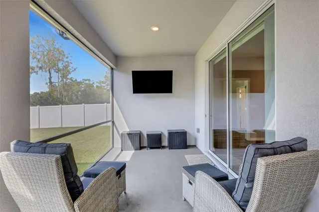 a view of a swimming pool with a yard and lake view