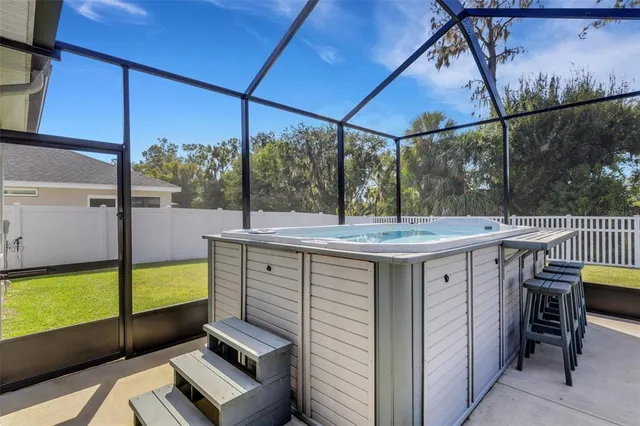 an aerial view of residential houses with outdoor space and city view