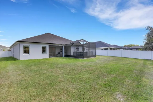 a view of a wooden deck with a yard