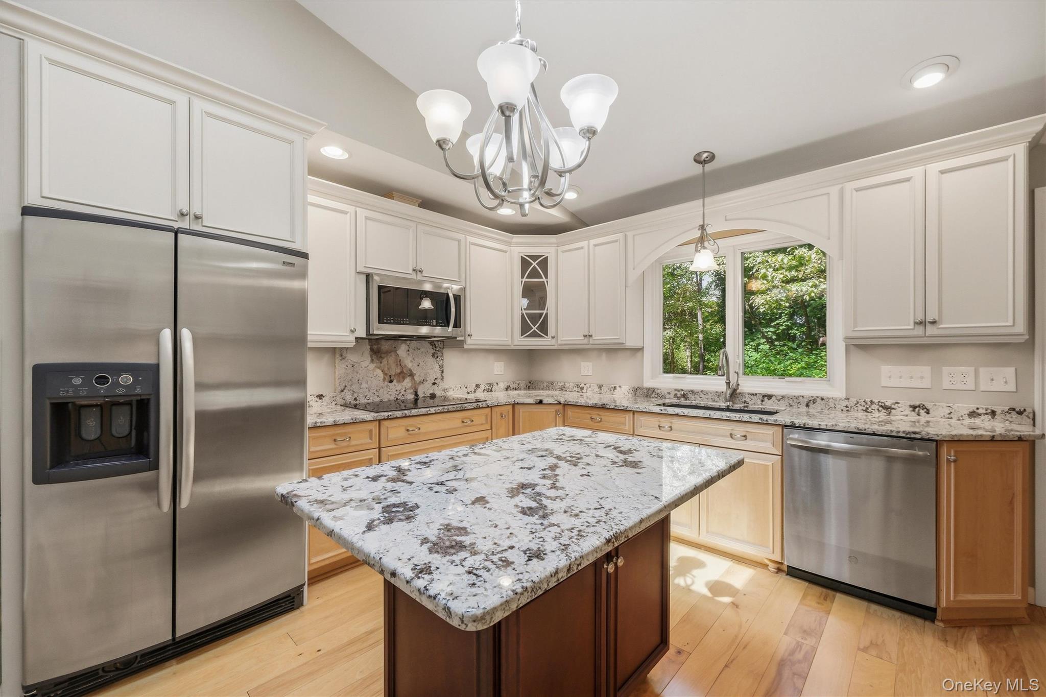 75 Pleasant Ridge Drive Poughkeepsie, NY 12603 - Photo 12 of 47 Custom kitchen with center island and snack bar, stainless appliances including double ovens, granite counters and wood floors