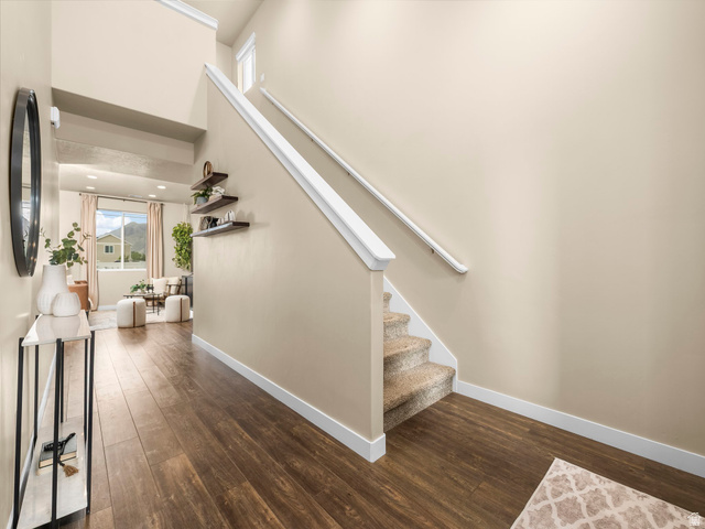 834 West 1050th Street South Springville, UT 84663 - Photo 5 of 26 Staircase with carpeted treads and white handrails