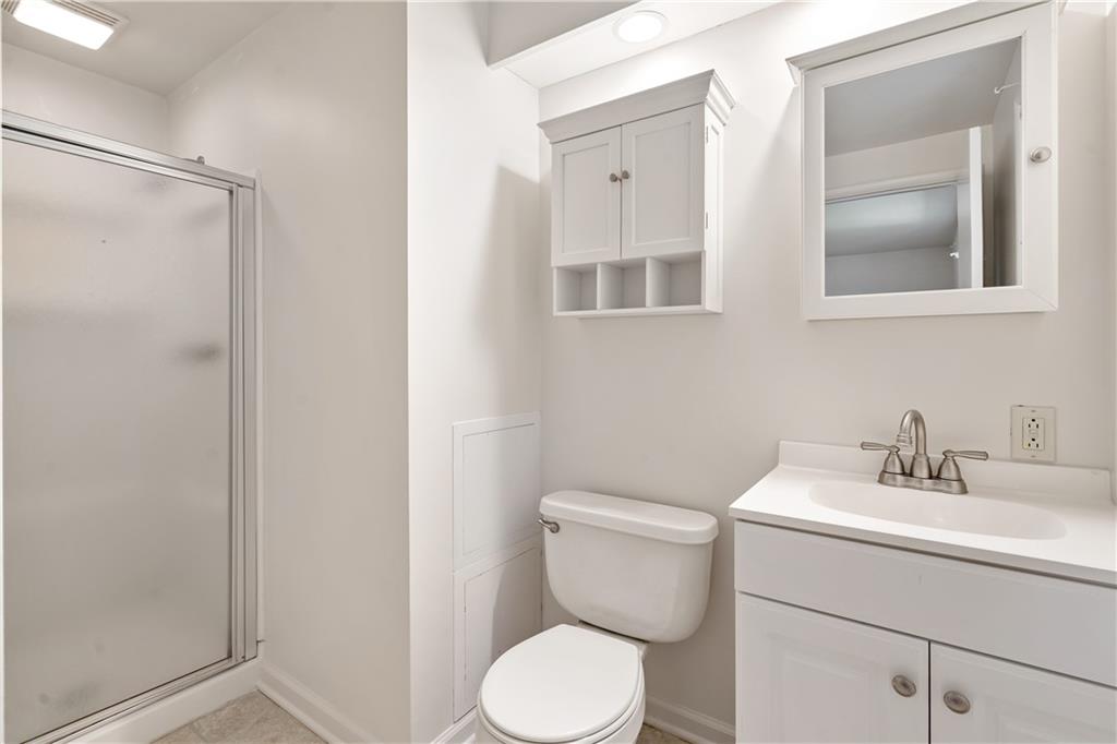 1318 Sky Ridge Drive Pittsburgh, PA 15241 - Photo 19 of 33 a bathroom with a toilet sink and mirror
