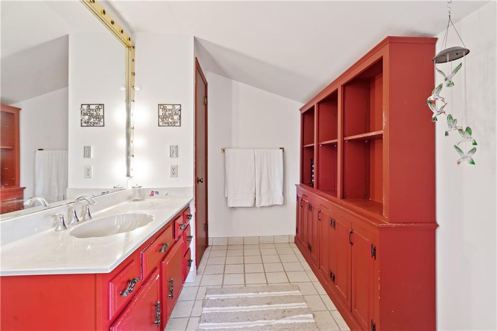 1318 Sky Ridge Drive Pittsburgh, PA 15241 - Photo 21 of 33 a hallway with cabinets a sink and a large window