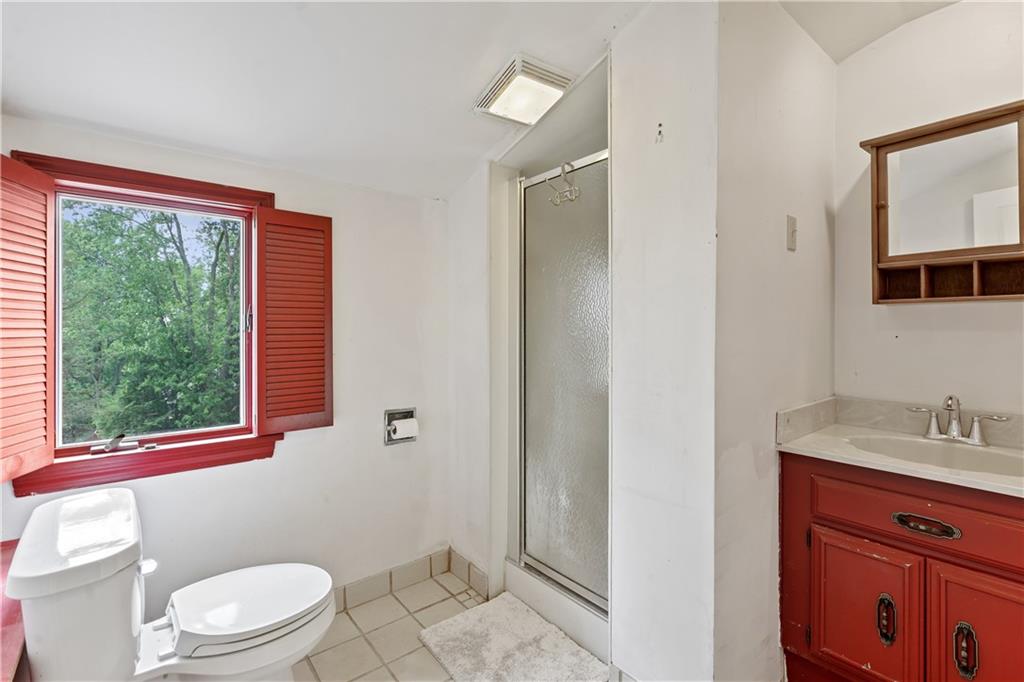1318 Sky Ridge Drive Pittsburgh, PA 15241 - Photo 23 of 33 a bathroom with a toilet a sink and a window