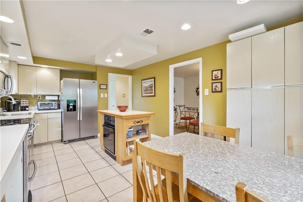 1318 Sky Ridge Drive Pittsburgh, PA 15241 - Photo 6 of 33 a kitchen with stainless steel appliances granite countertop a refrigerator and a stove top oven