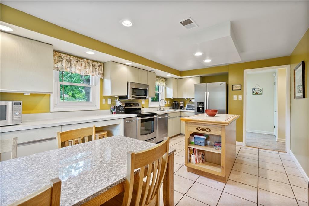 1318 Sky Ridge Drive Pittsburgh, PA 15241 - Photo 7 of 33 a kitchen with stainless steel appliances granite countertop a stove a sink and a refrigerator