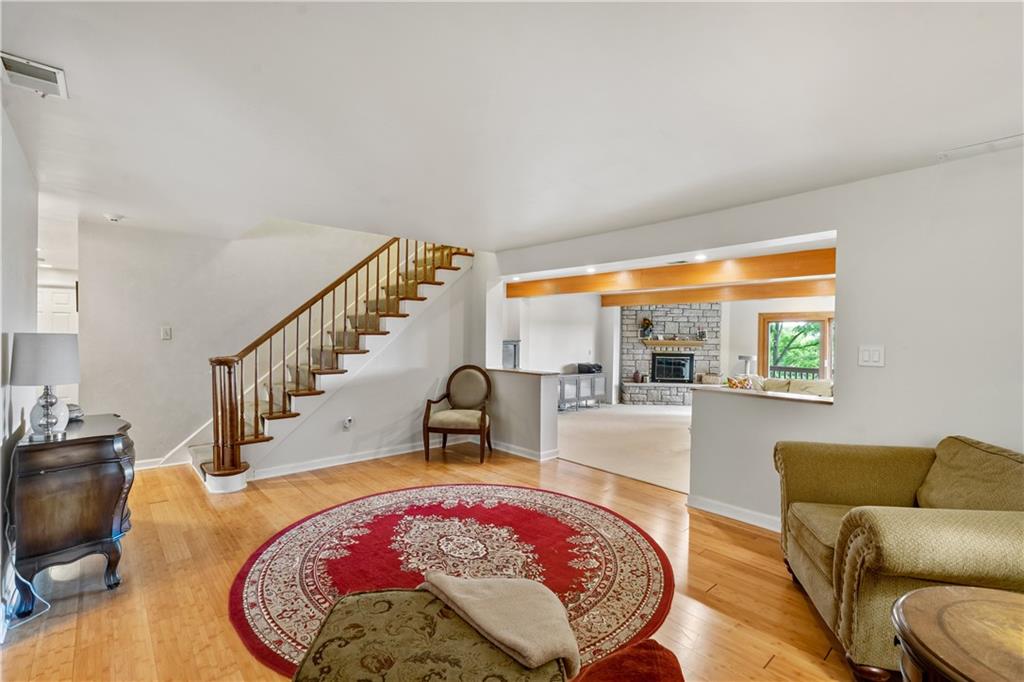 1318 Sky Ridge Drive Pittsburgh, PA 15241 - Photo 10 of 33 a view of a living room and a dining room with a rug