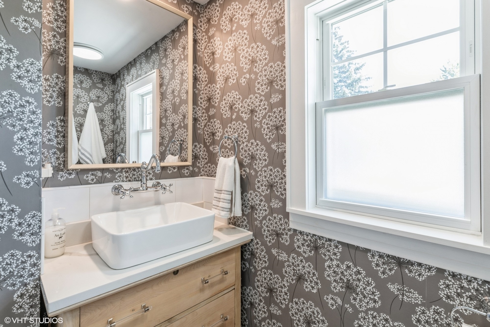 613 South Prospect Avenue Park Ridge, IL 60068 - Photo 17 of 29 a bathroom with a sink and a mirror