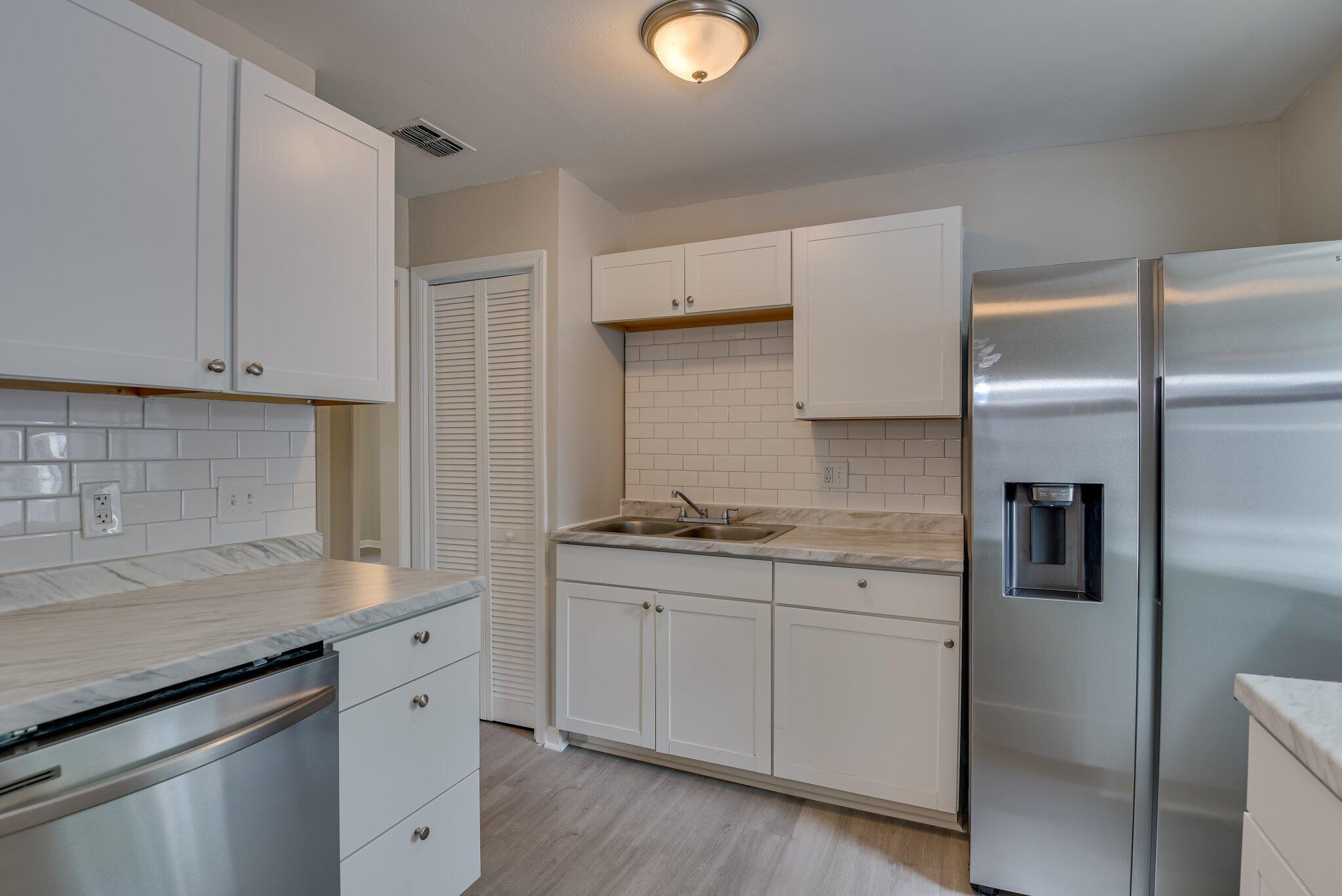 2115 Ashley Drive Augusta, GA 30906 - Photo 14 of 38 a kitchen with stainless steel appliances granite countertop a sink and a refrigerator