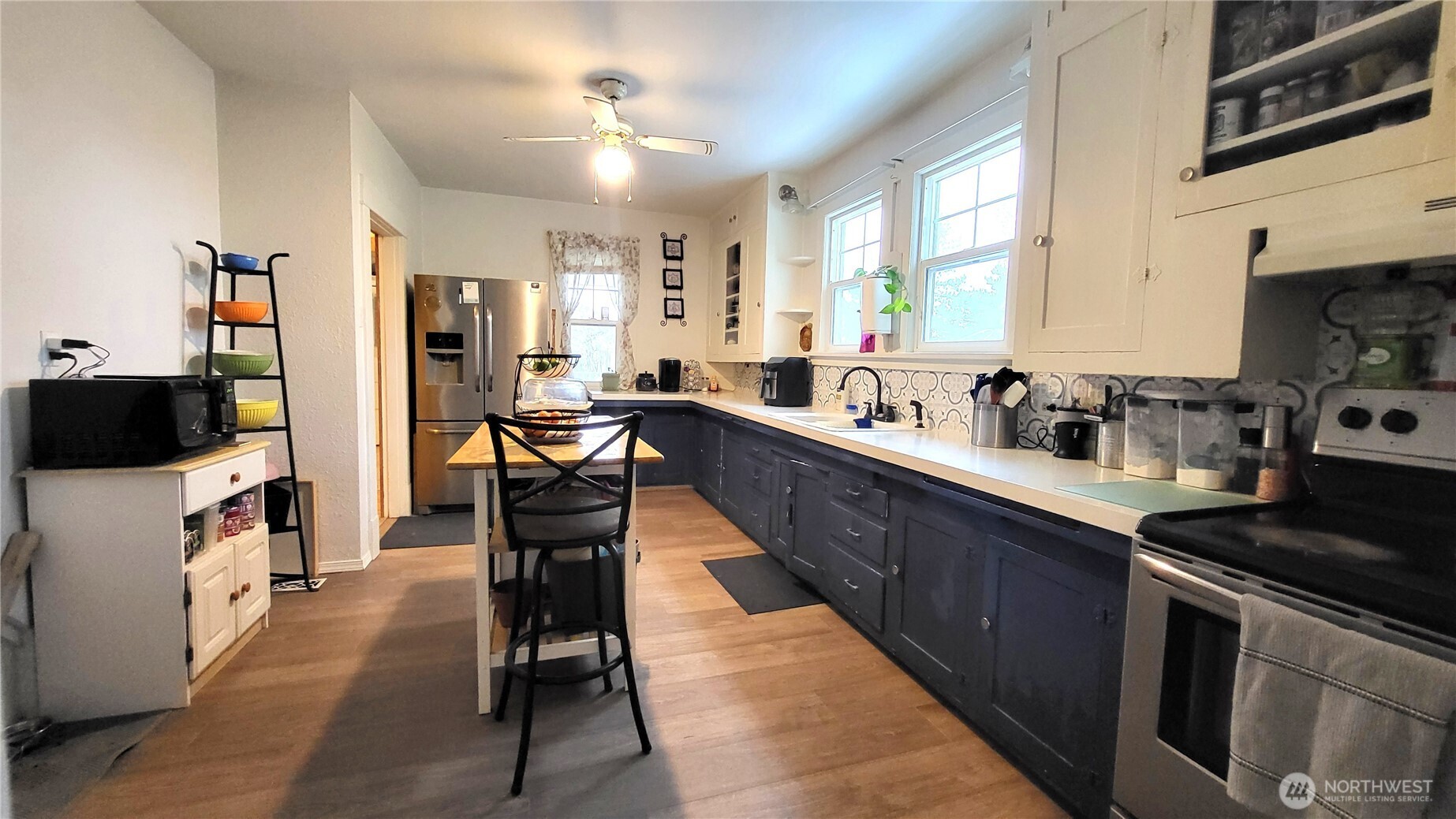 1113 South County Road Warden, WA 98857 - Photo 20 of 40 a kitchen with stainless steel appliances granite countertop sink stove top oven and cabinets