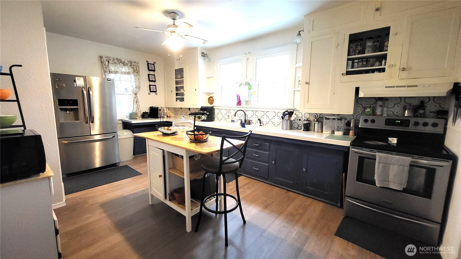 1113 South County Road Warden, WA 98857 - Photo 21 of 40 a kitchen with a stove a refrigerator and a stove top oven