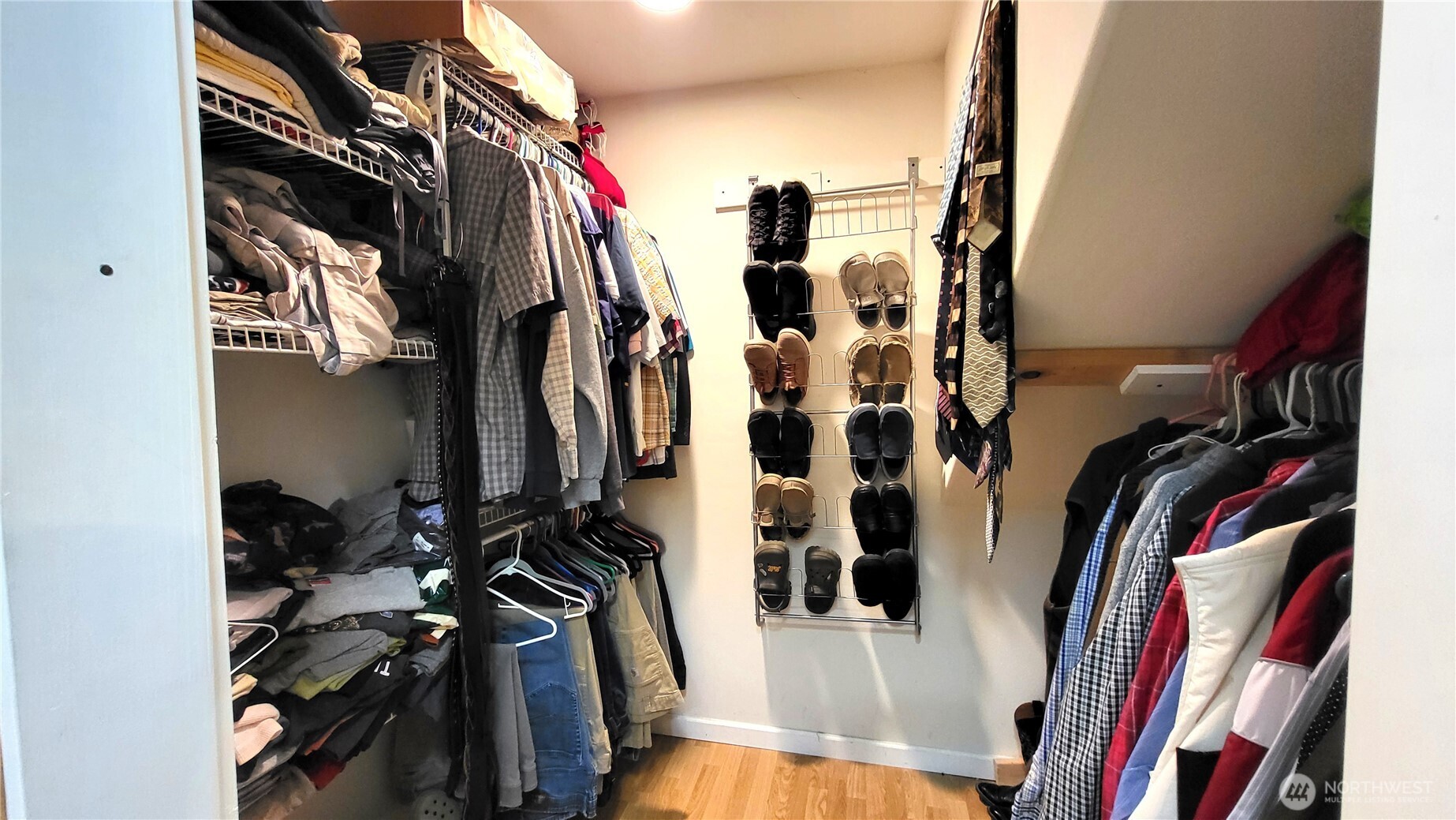 1113 South County Road Warden, WA 98857 - Photo 28 of 40 a view of walk in closet with clothes and shoes