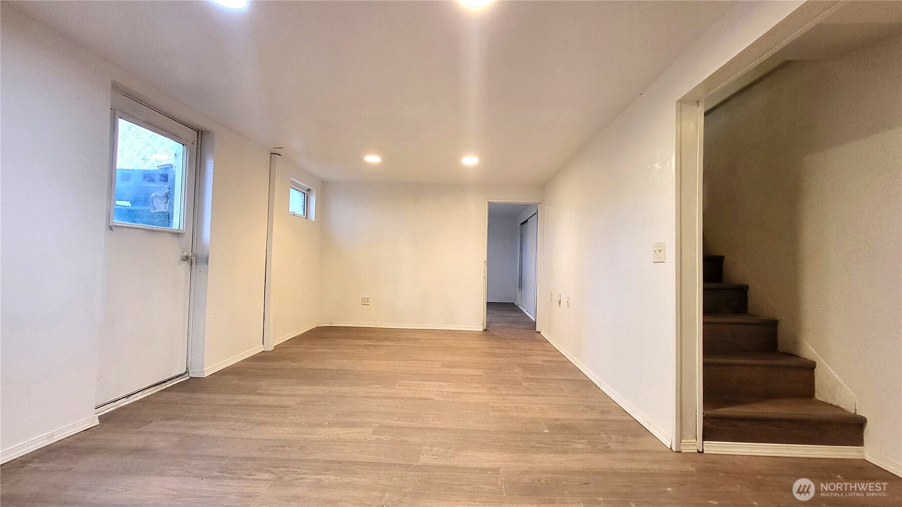 1113 South County Road Warden, WA 98857 - Photo 34 of 40 a view of a hallway with wooden floor and staircase