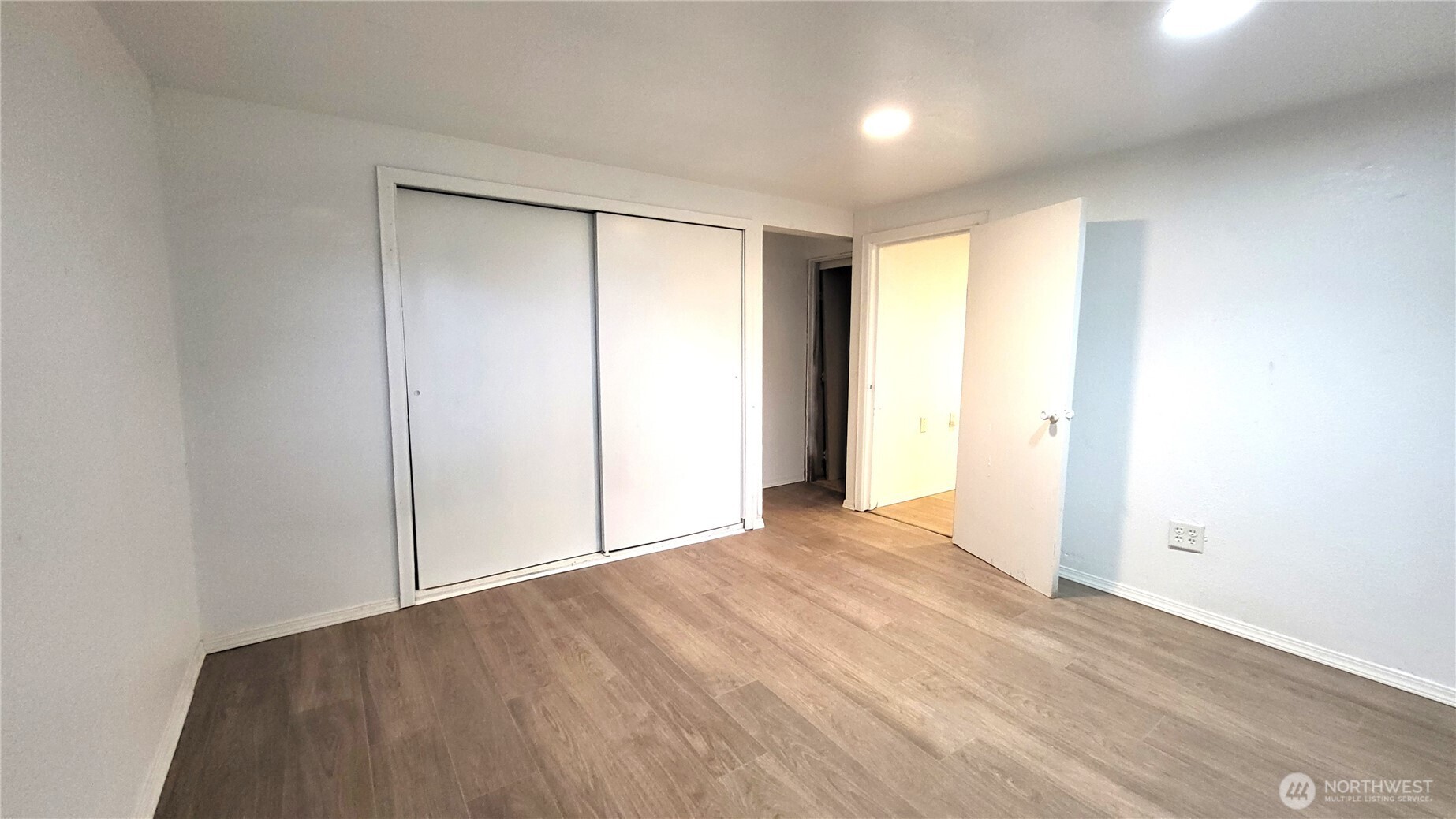 1113 South County Road Warden, WA 98857 - Photo 36 of 40 wooden floor in an empty room with a window