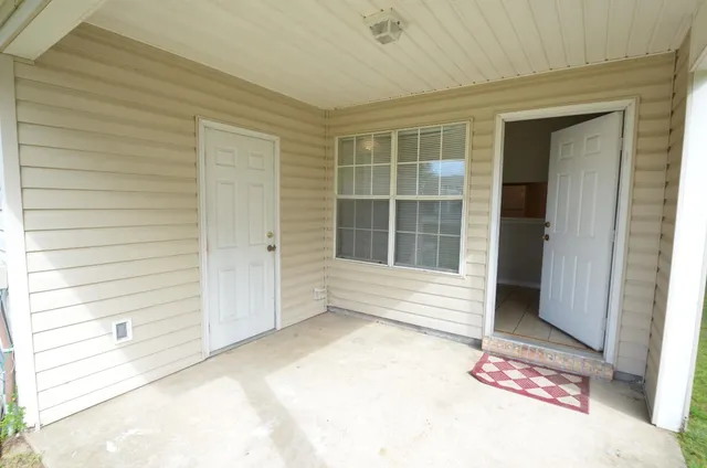 a view of a door and a window