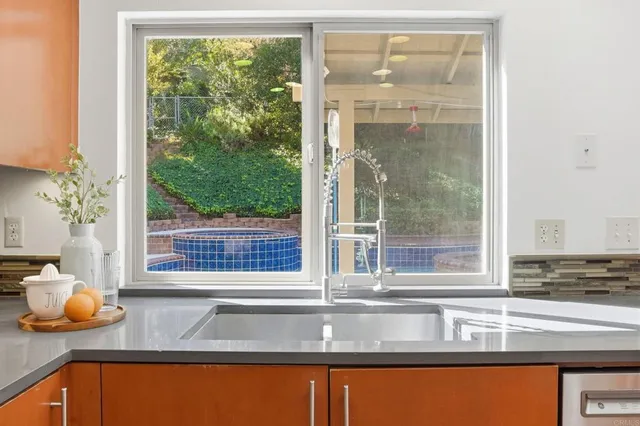 a view of a sink and a window