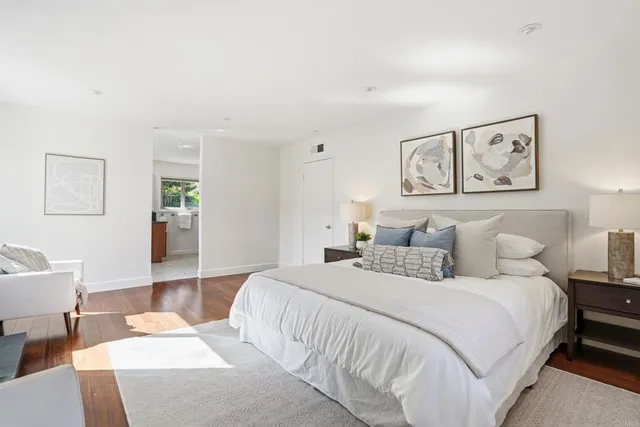 a bedroom with a bed and a couch