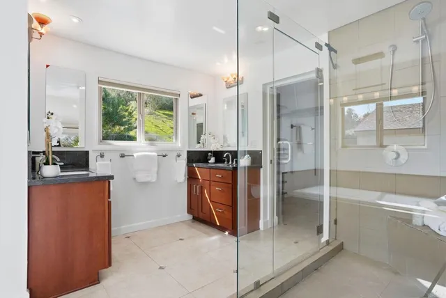 a open kitchen with stainless steel appliances granite countertop a refrigerator and a sink