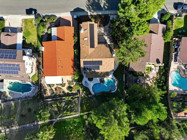 an aerial view of a house with outdoor space
