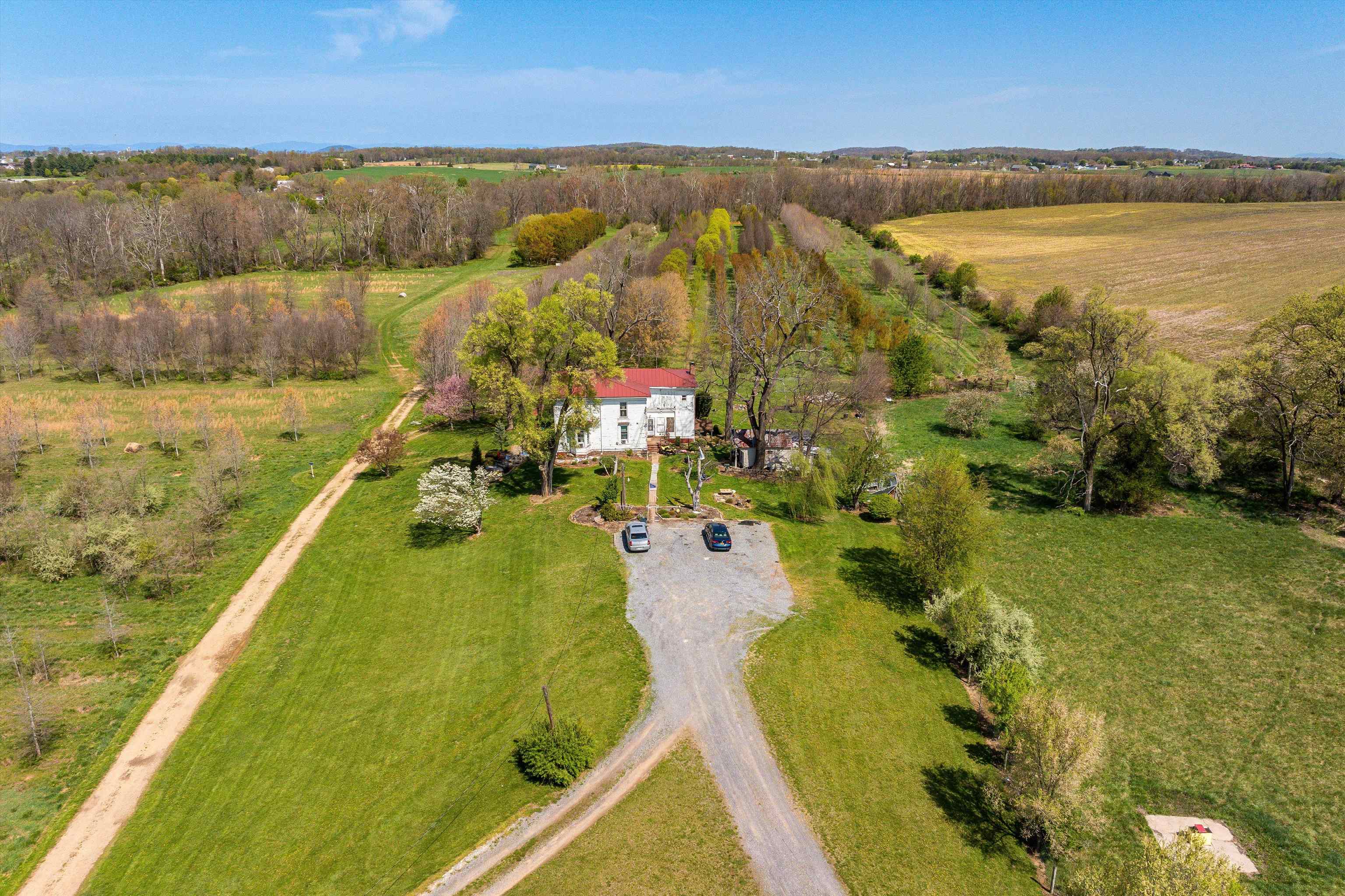 514 Lipscomb Road Stuarts Draft, VA 24477 - Photo 22 of 38 a view of a lake with a city
