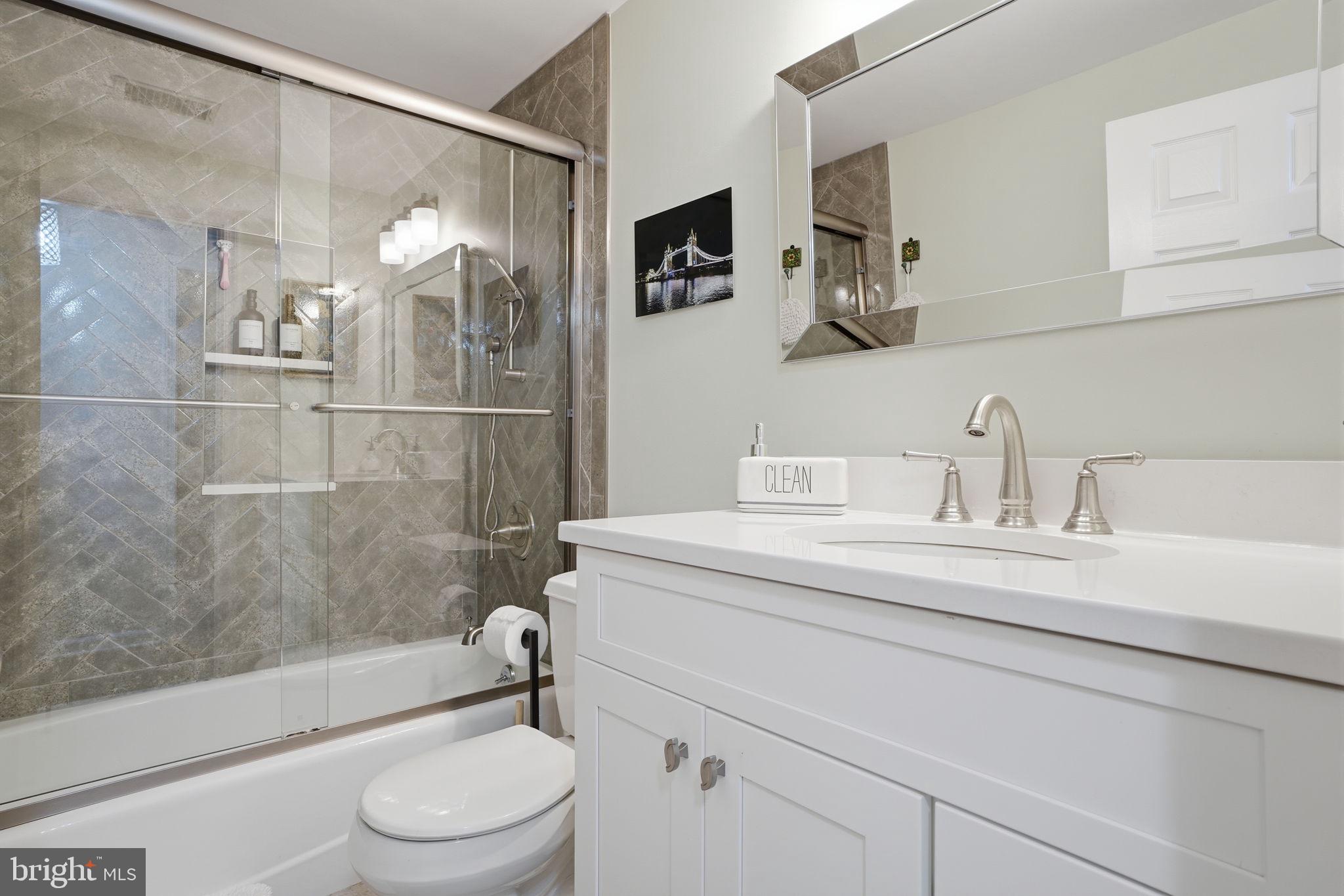 621 River Road Yardley, PA 19067 - Photo 33 of 75 a bathroom with a sink a toilet and shower