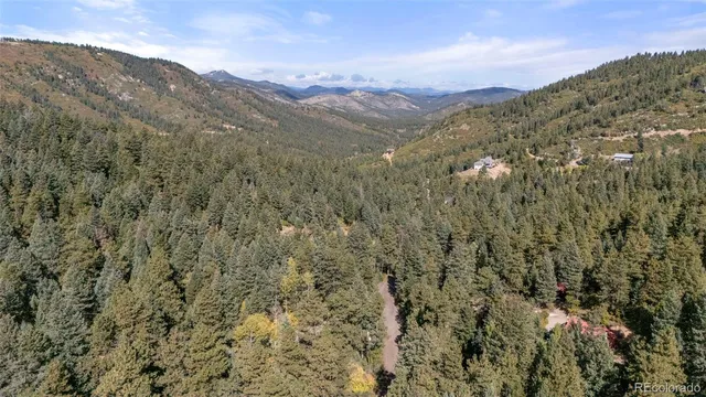 a view of a city with mountains in the background