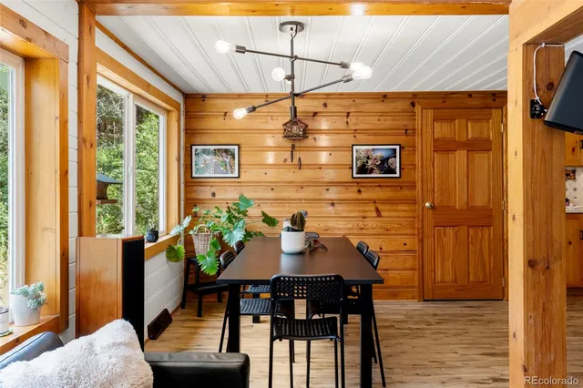 a view of a dining room with furniture and window