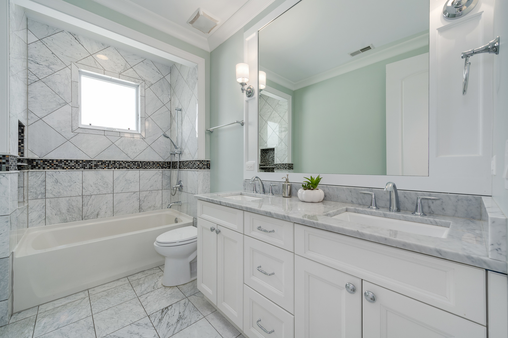 1734 West Fletcher Street Chicago, IL 60657 - Photo 24 of 34 a bathroom with a granite countertop toilet a sink and bathtub