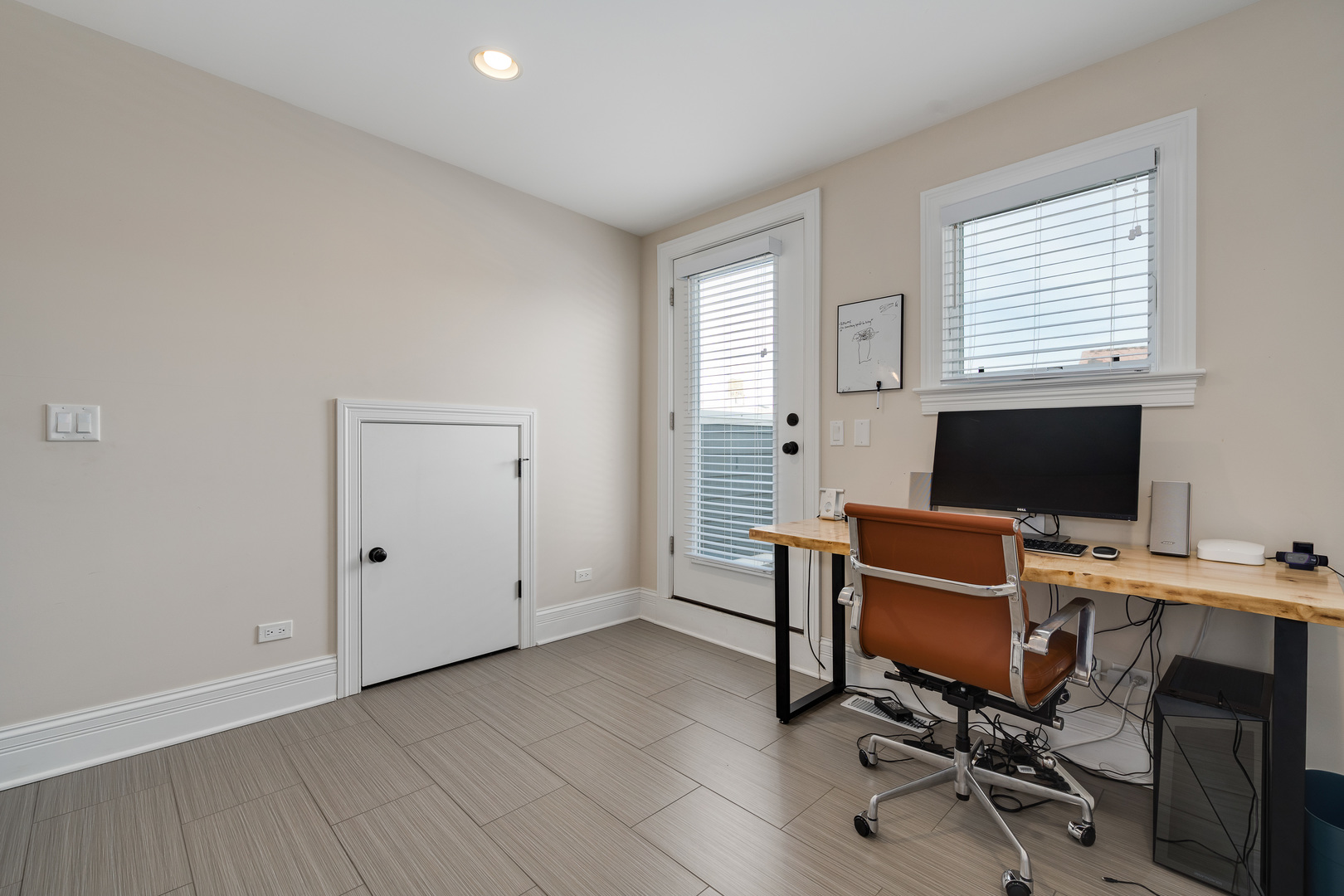 1734 West Fletcher Street Chicago, IL 60657 - Photo 26 of 34 a view of a workspace with furniture and a window