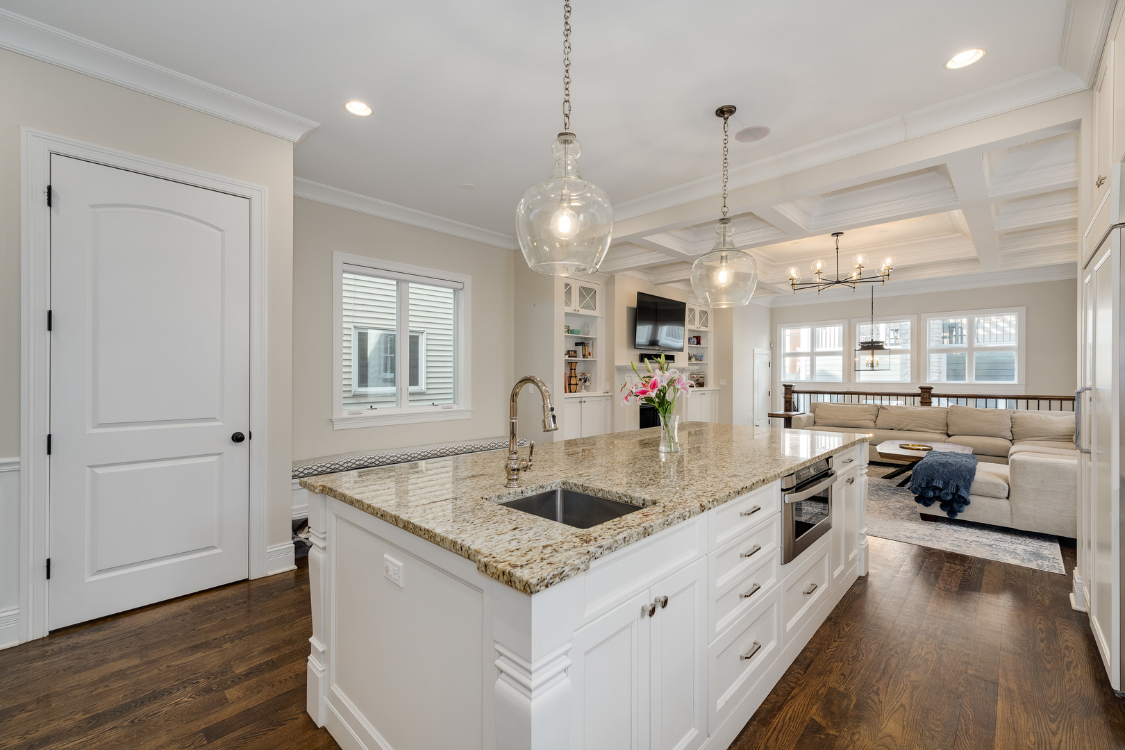 1734 West Fletcher Street Chicago, IL 60657 - Photo 5 of 34 a kitchen with stainless steel appliances granite countertop a sink a oven and a large window with wooden floor
