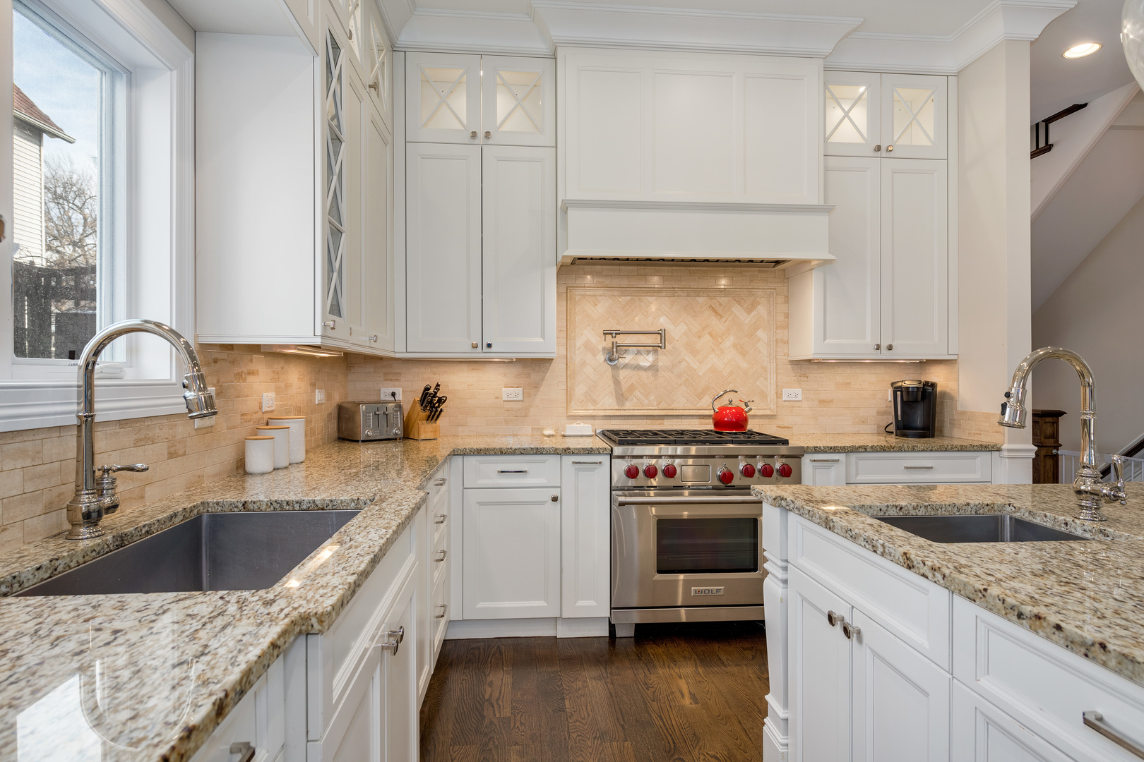 1734 West Fletcher Street Chicago, IL 60657 - Photo 6 of 34 a kitchen with a sink cabinets and stainless steel appliances