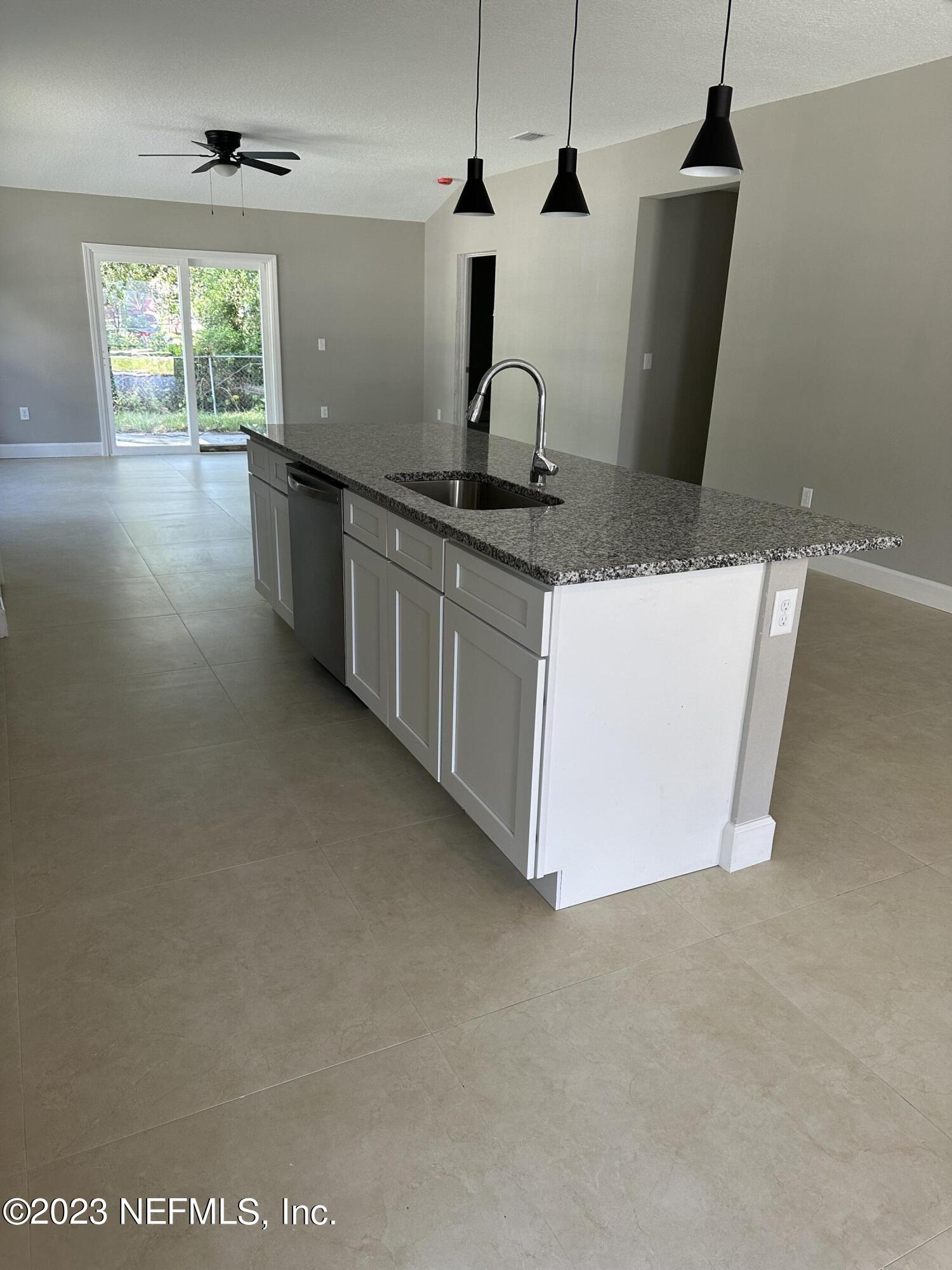 2829 Fleming Street Jacksonville, FL 32254 - Photo 12 of 24 a kitchen with a sink and wooden floor
