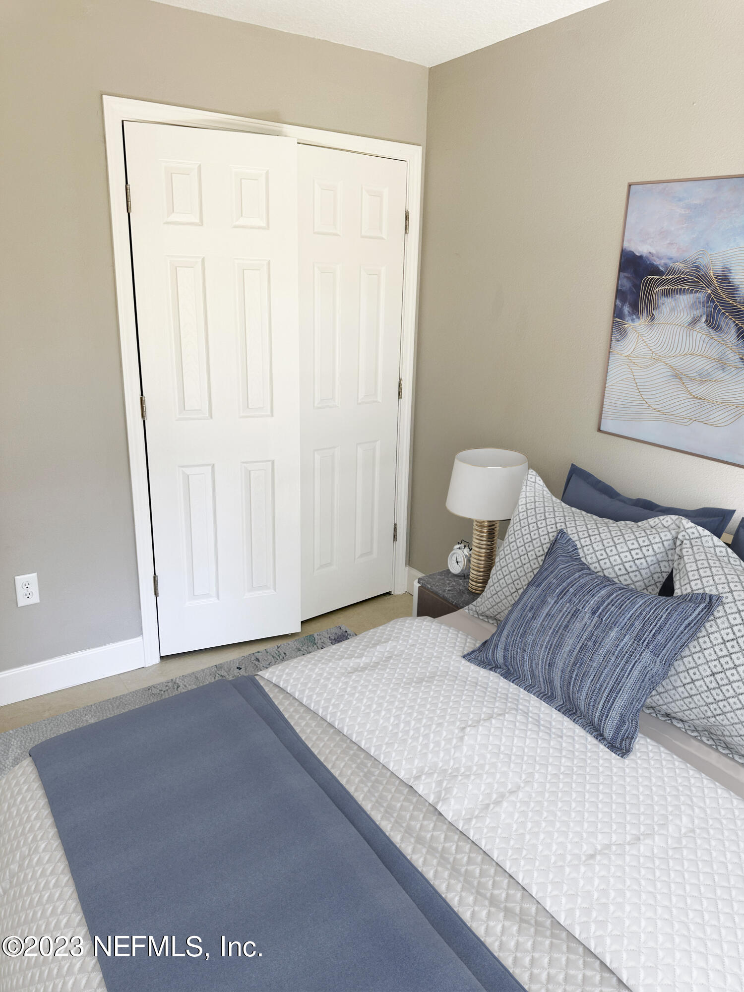 2829 Fleming Street Jacksonville, FL 32254 - Photo 22 of 24 a bedroom with a bed and a painting on the wall