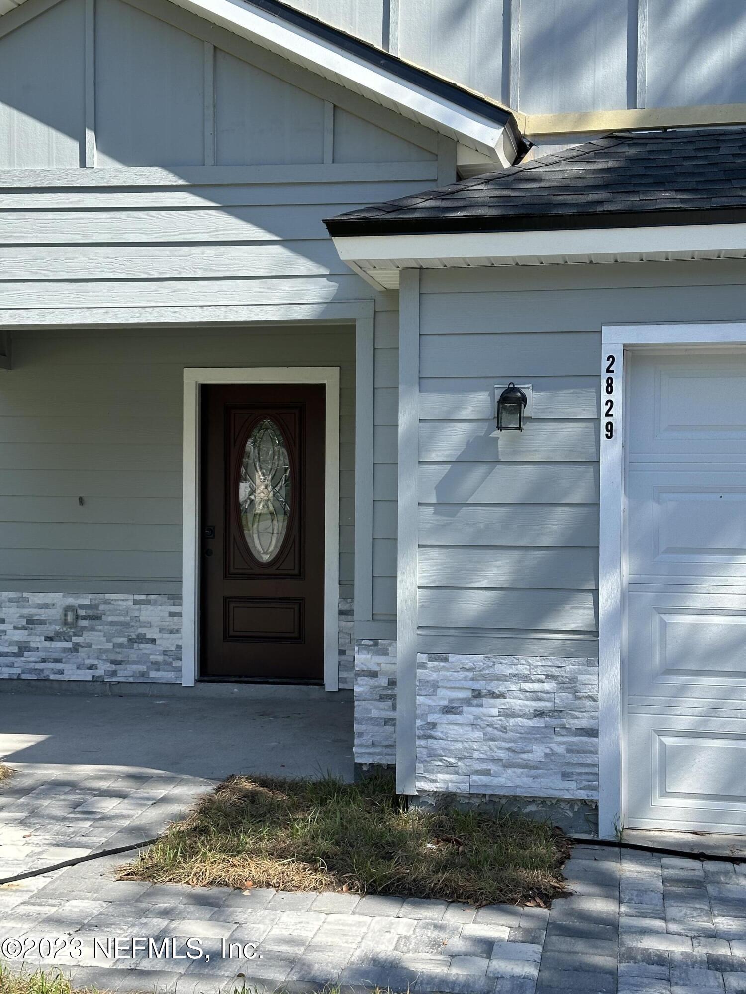 2829 Fleming Street Jacksonville, FL 32254 - Photo 3 of 24 a view of fireplace and window