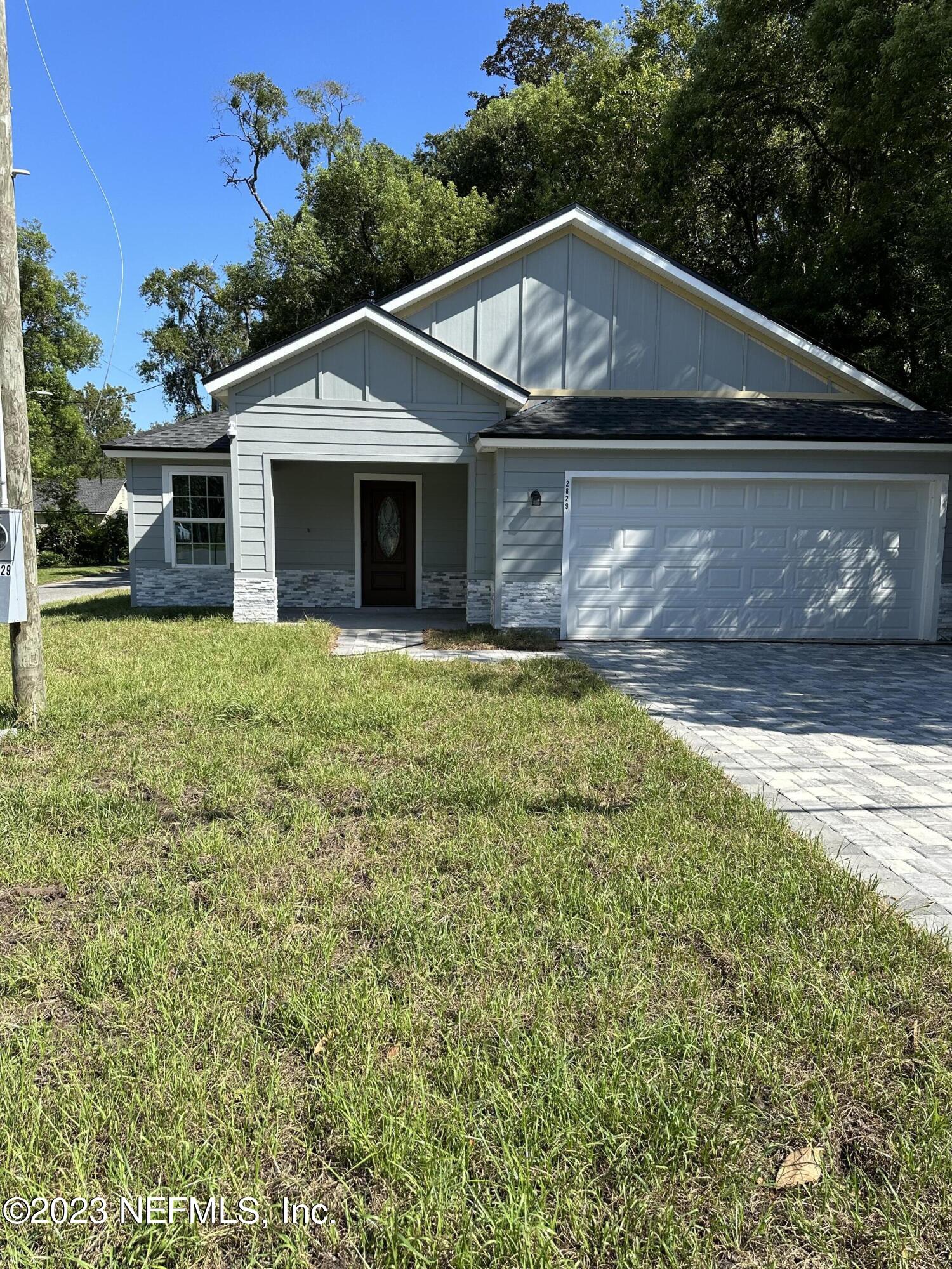 2829 Fleming Street Jacksonville, FL 32254 - Photo 6 of 24 a front view of a house with a yard