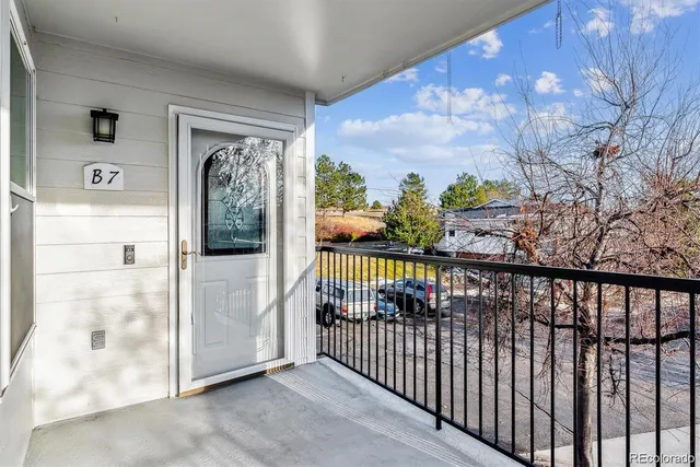 a view of a balcony with a potted plant