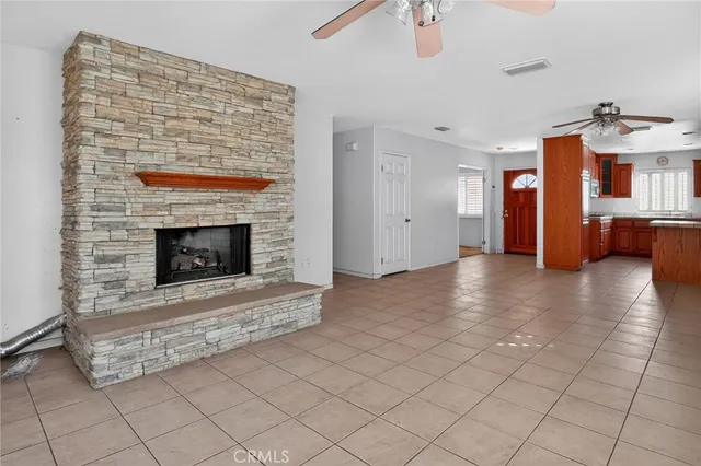 an empty room with windows and cabinet