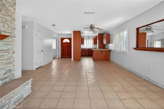 a kitchen with stainless steel appliances granite countertop a sink counter space cabinets and a large window