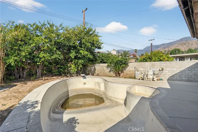 a view of a swimming pool with a patio