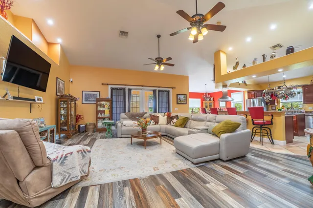 a kitchen with stainless steel appliances granite countertop a stove a microwave and a refrigerator