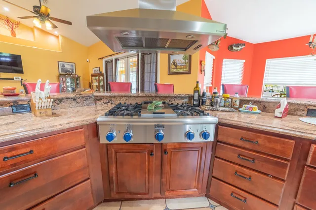 a spacious bedroom with a bed and wooden floor