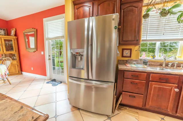 a view of a bedroom with wooden floor