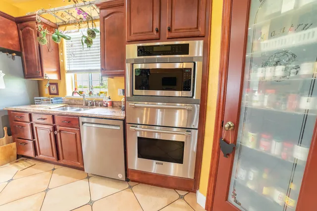 a bathroom with a sink vanity and a mirror