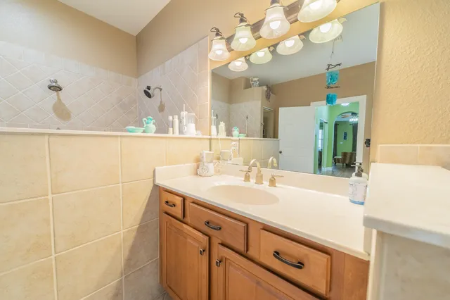 a backyard of a house with table and chairs