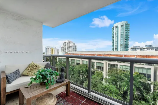 a view of a balcony with chairs