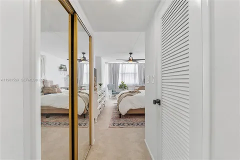 a bathroom with a glass door shower and a sink