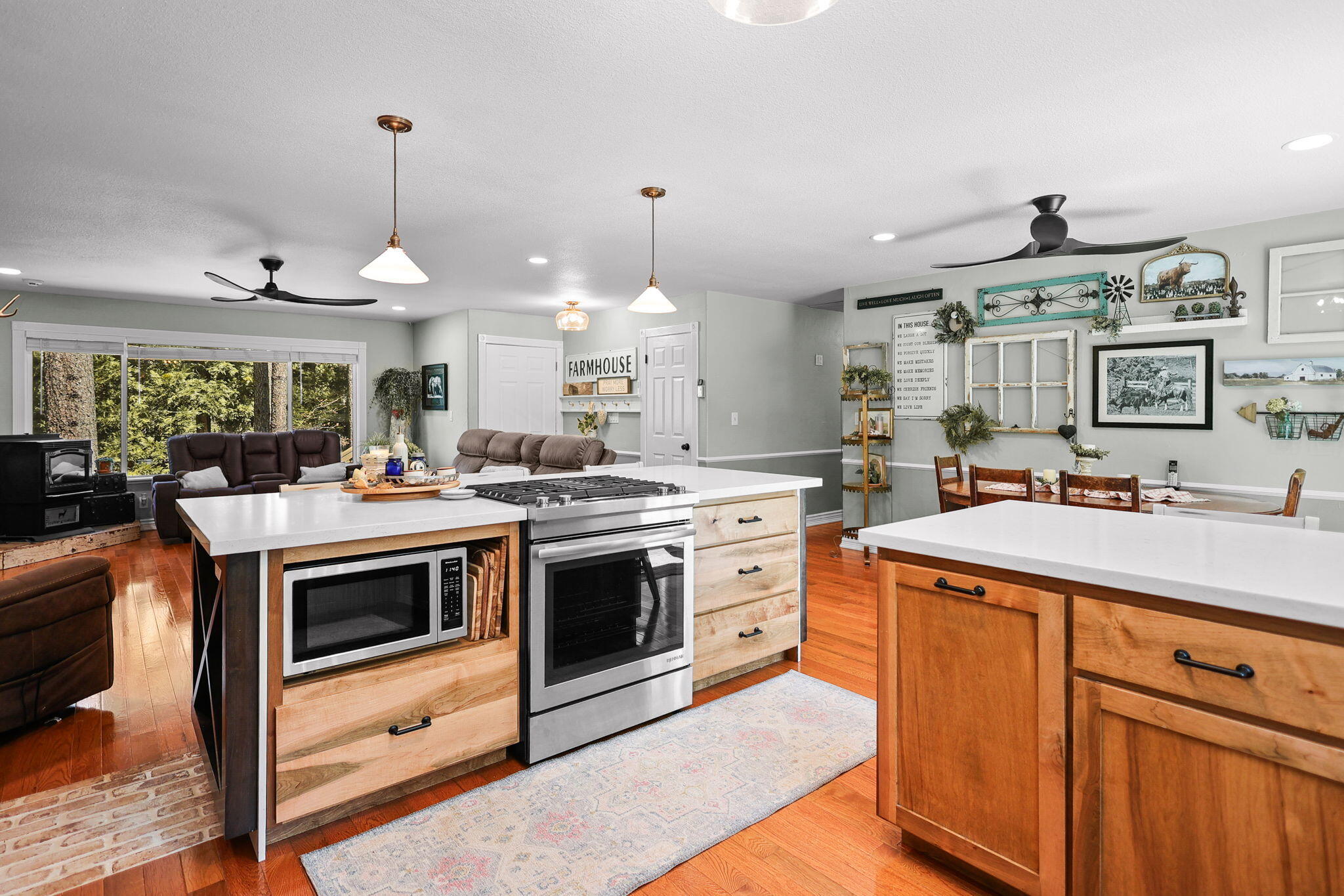 30726 Shingletown Ridge Road Shingletown, CA 96088 - Photo 18 of 84 a kitchen with stainless steel appliances granite countertop a sink a stove and a wooden floors